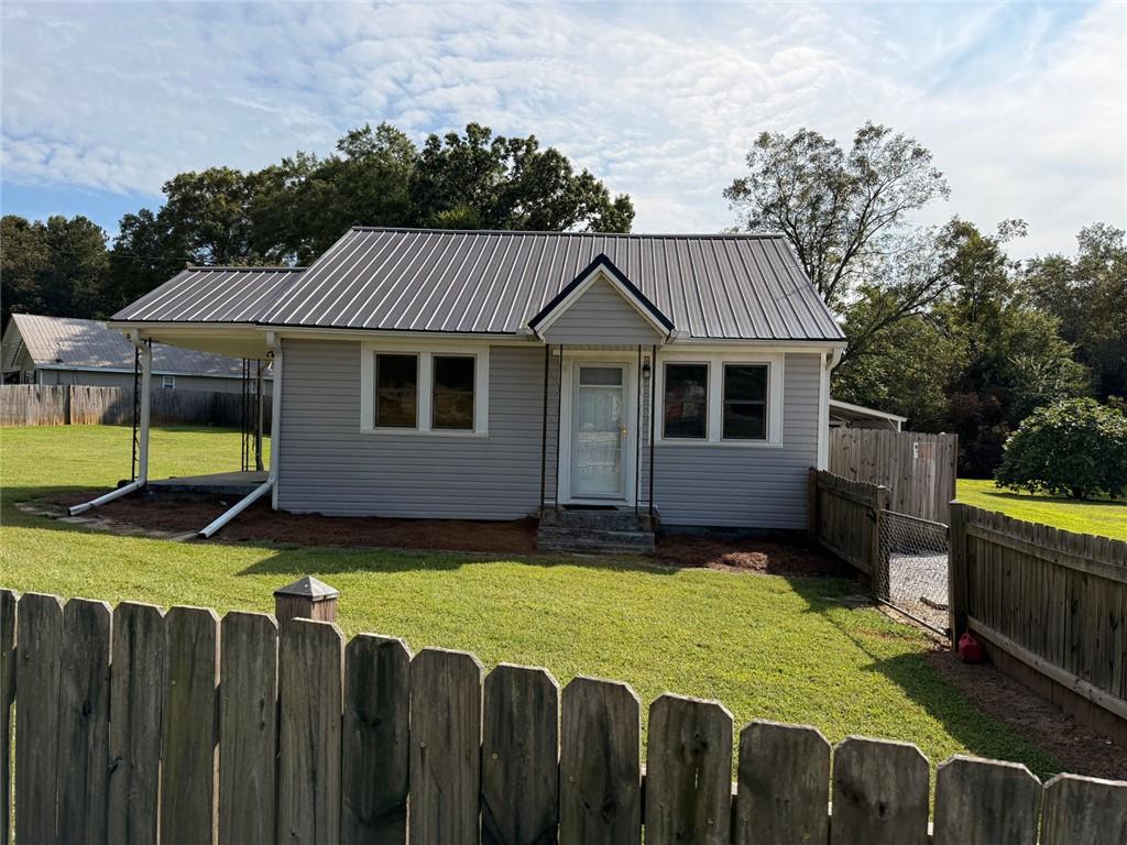 Don't let size fool you--this home packs a punch! Sitting proudly on a .64 acre fully fenced lot, it offers space, privacy, and extras you don't see every day! Enjoy 2 porches and 3 entrances and an impressive 3 garages for storage, cars, toys or workshop. A full kitchen renovation was just completed. This home features all new cabinets, appliances, light fixtures and fans, granite counters, new flooring throughout and a new hot water heater.
Best of all, you are just minutes from Historic Downtown Monroe--where shopping, dining, coffee spots and community events are always around the corner. This is within the golf cart community, and a prime Monroe location.