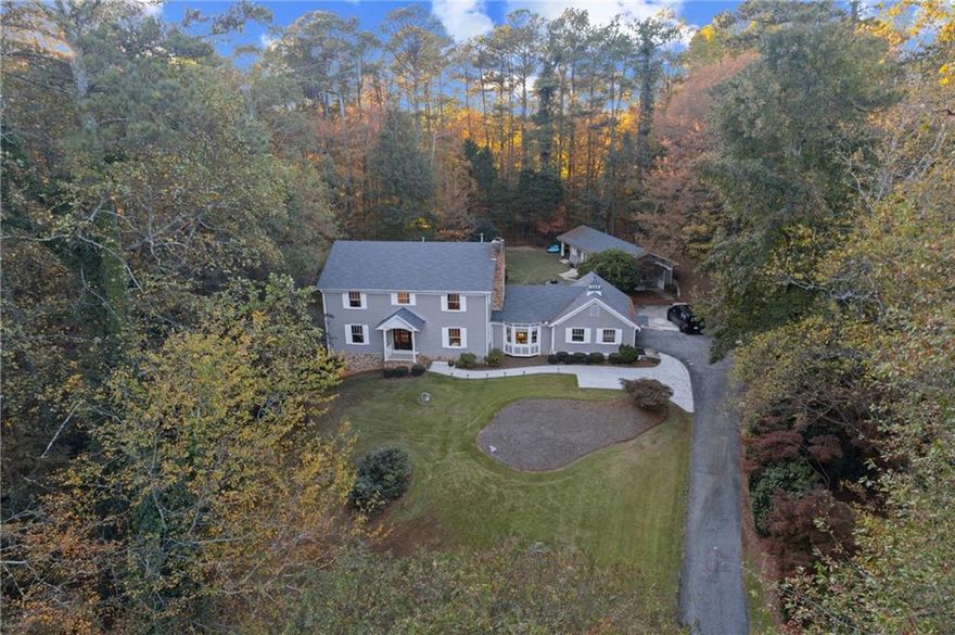 Discover this stunning remodeled detached home nestled on a picturesque large wooded lot in the heart of Sandy Springs. With 5 bedrooms and 5 bathrooms, this residence offers both space and versatility, featuring 4 bedrooms and 4 baths in the main house, plus a separate guest house or office complete with a movie room, bedroom, and full bath—ideal for guests or a private workspace. Inside, you'll find gleaming hardwood flooring throughout and a fireside family room topped with an elegant wood trey ceiling. French doors open onto a large deck, perfect for relaxing or entertaining. The gourmet eat-in kitchen is a chef’s dream, boasting custom cherry cabinetry, granite counters, a distressed walnut island, Thermador 48" range, and premium appliances. Upstairs, the primary suite delights with a trey ceiling, custom walk-in closet, and a luxurious bath featuring travertine, a Kohler spa tub, and a rain-and-body jet shower. The main level includes a guest room with a private bath, as well as a flexible office or living room space. Located near highly rated schools, this beautifully home offers comfort, style, and exceptional convenience to Downtown Atlanta, Buckhead as well as North Atlanta.