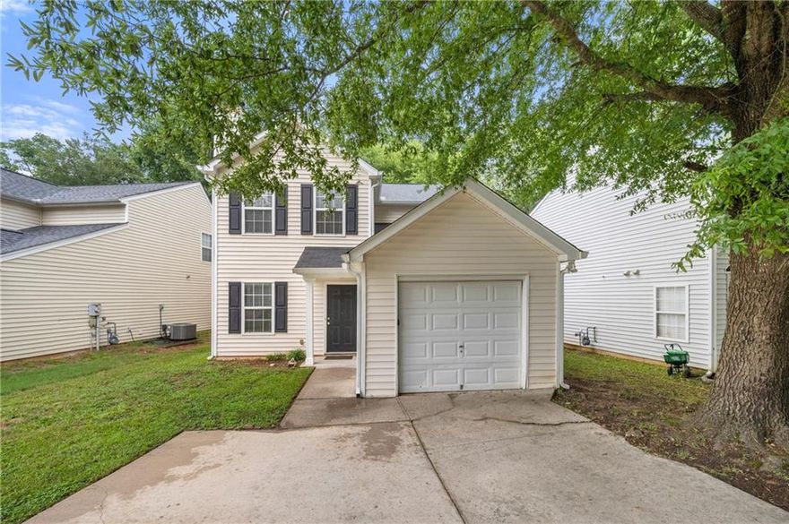 Discover this quaint home in the heart of Marietta! Move in ready and close to shopping, restaurants, trails and easy access to I-285/I-75. Through the entry, you'll find an open Living Space with fireplace, carpeted Dining Room, Kitchen and main level Primary Bedroom with ensuite bathroom. The kitchen provides stainless steal appliances, pantry and stone counter tops. The side entryway is off the dining area that leads to a freshly painted deck and open backyard. Upstairs provides three additional bedrooms as well as the second bath with a shower/tub combo, single vanity and a linen closet. This home features a one car garage where you'll find the washer and dryer. The driveway provides plenty of extra parking space. Freshly painted walls and recently cleaned carpet. Don't miss out!