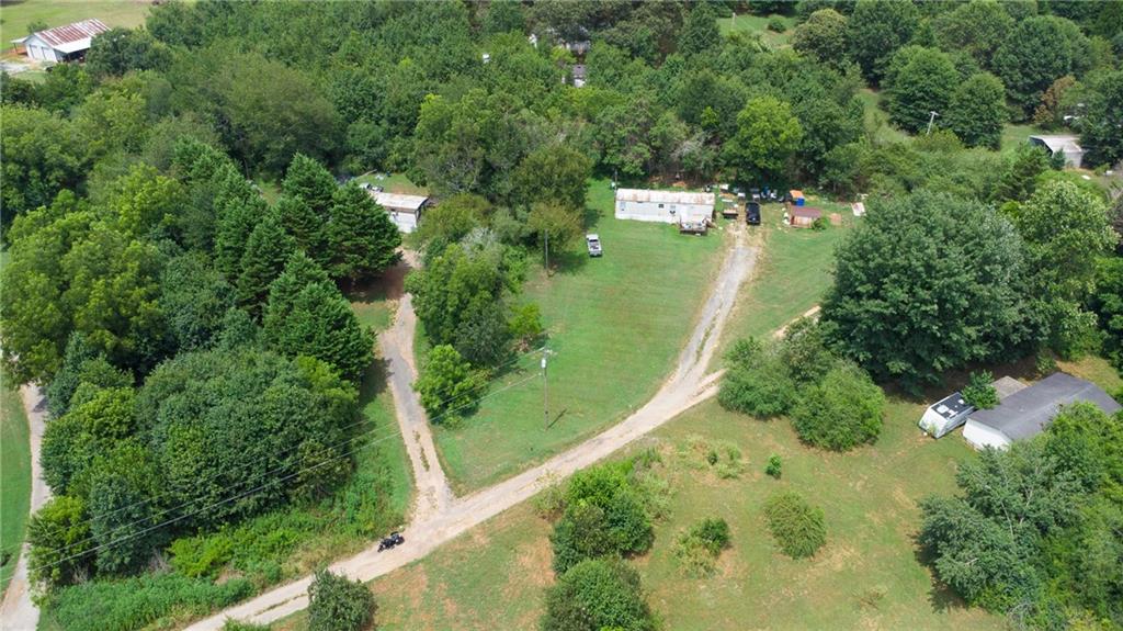 The opportunity of a lifetime. This property consist of two mobile homes that currently produce income and two acres. Beautiful land to build your future home on while you occupy one of the mobile homes or keep for investment property. 5719 Parks Rd is a 3 bedroom 2 bathroom home built in 1980 and is approximately 924 sq ft. 5707 Parks Rd is a 2 bedroom 1 bath home built in 1993 and is approximately 644 sq ft.