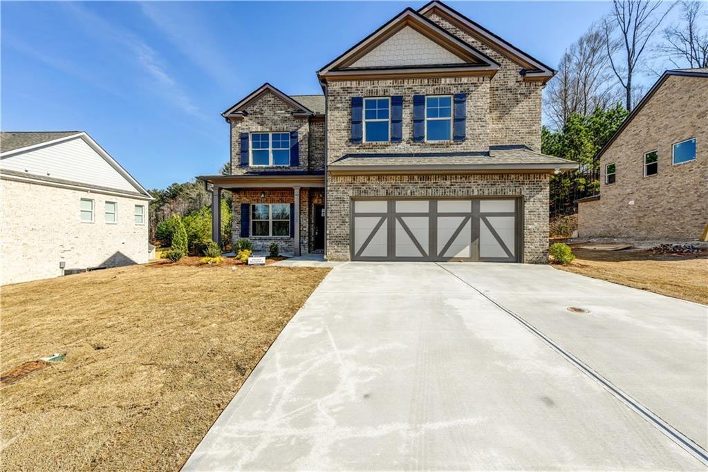 Beautifully designed and move-in ready, this spacious 4-bedroom, 4.5-bath home in the Chestnut Park subdivision offers comfort, functionality, and style in the highly sought-after Buford City School district. The home welcomes you with a two-story foyer and features hardwood floors on the main level, a separate dining room with elegant trim details, and a bright family room with a gas fireplace. The gourmet kitchen includes a massive island, granite countertops, stainless steel appliances, 42" white cabinetry, and double ovens—perfect for hosting and everyday living. Upstairs, the oversized owner's suite boasts two walk-in closets, a sitting area, and a luxurious bath with a frameless shower and soaking tub. All bedrooms are generously sized, and a full bathroom is conveniently located on the main floor. Enjoy a private backyard and quiet community living, just minutes from downtown Buford, shopping, and dining. Additional highlights include a 2-car garage, front porch, patio, and modern finishes throughout.
