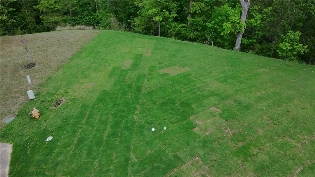 Build the home you’ve been envisioning on this spacious .48-acre lot at **25 Greencliff Way, Cartersville, GA** in the desirable Carter Grove Subdivision! Tucked away at the end of a quiet cul-de-sac, this property offers privacy while being part of a vibrant community. Fully developed and ready for construction, it provides the perfect foundation for your future home.
Carter Grove Subdivision is known for its top-notch amenities, including a sparkling community pool, tennis courts, and a stylish clubhouse—perfect for social gatherings. The tree-lined streets and serene surroundings add to the neighborhood’s charm, making it a fantastic place to call home. Enjoy the convenience of being just minutes away from downtown Cartersville, with easy access to local shopping, dining, and entertainment.
With its generous size and excellent location, this lot offers a rare opportunity to build in one of Cartersville’s most sought-after communities. Don’t miss your chance—contact us today to learn more or schedule a visit to see it for yourself!