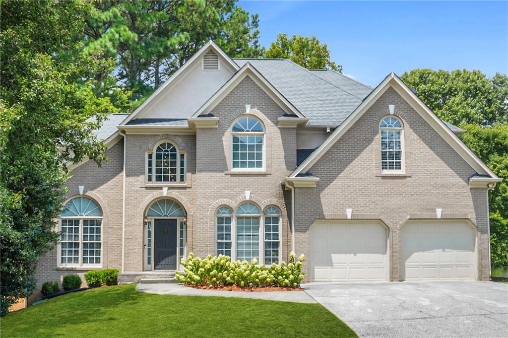 Welcome to your serene escape in the heart of West Cobb. Nestled on a rare 0.36-acre lakefront lot in the sought-after Alexander Farms community, this light-filled executive home offers the perfect balance of comfort, elegance, and peaceful retreat, all just minutes from top-rated schools and vibrant local amenities.
From the rocking chair front porch to the sweeping lake views off the spacious back deck, every detail of this home exudes warmth and charm. Step inside to a freshly painted interior with luxury vinyl plank flooring throughout the main and upper levels. The two-story foyer is flanked by a formal dining room and a flexible front room, perfect as a home office, playroom, craft space, or study.
The heart of the home is a dramatic two-story family room with expansive windows and a cozy fireplace, seamlessly connected to the large deck. This space is perfect for entertaining or enjoying tranquil mornings overlooking the water.
The open-concept kitchen features a generous breakfast area with lake views, ample cabinetry, shelving, and stainless steel appliance package. The main level also includes a full guest bedroom and bathroom, as well as a convenient laundry room with a washer and dryer.
Upstairs, you'll find an oversized master suite with a private sitting area, tray ceiling, large his-and-hers walk-in closets, and a vaulted en-suite bath with a soaking tub and separate shower. Three additional bedrooms and a shared full bath provide plenty of space for family or guests.
The fully finished basement expands your living space with a full bathroom, a bar area, multiple bedrooms, storage, and flexible space that can be used as a media room, home gym, guest suite, or anything you envision. The possibilities are endless.
Located minutes from Cheatham Hill Elementary, Lovinggood Middle, and Hillgrove High, this home also offers quick access to The Avenue West Cobb, local parks, shops, resturants, Marietta Square, and Kennesaw Mountain.
Whether you're entertaining on the deck, working from your front room, or simply sipping coffee while enjoying the lake view, this home truly feels like a getaway without going away.