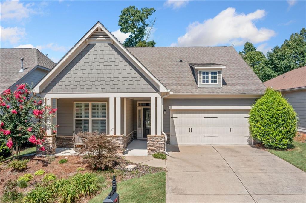 Nestled on the fifth hole of the golf course, this beautifully maintained Emerson model offers 1,825 sq ft of single level living in one of the area's most sought-after active adult communities. The home features a spacious primary suite with an en-suite bath, a private guest bedroom and full guest bath, an open-concept living and dining area, and a well-appointed island kitchen—perfect for entertaining. Additional highlights include an attached garage, a new water heater (installed 6 months ago), and updated carpeting (2 years old). Located within a vibrant 500-acre master-planned community, residents enjoy resort-style amenities including a 30,000 sq ft clubhouse, indoor pool, racquet club with a certified tennis and pickleball pro, and a full-time fitness instructor. Two on-site activities directors coordinate a wide range of clubs and events to suit every interest—billiards, cooking, gardening, arts and crafts, book clubs, games, bocce, cornhole, and more. Whether you're enjoying serene golf course views at home or exploring the endless community activities, this move-in-ready home offers the ideal blend of comfort, community, and active living.