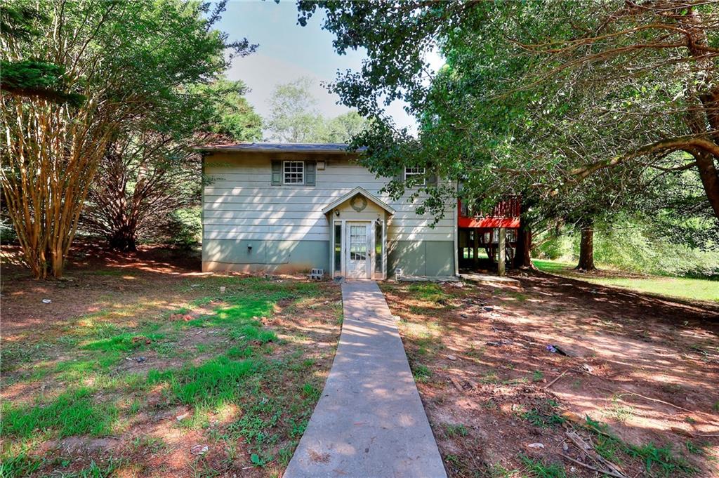 Fixer upper on almost 9 acres just outside the city limits of Monroe. This lot is private and secluded yet moments away from downtown Monroe. The home is in need of a full remodel. The structure was originally built in 1984. It has over 2000 sq ft of living space. BRING ALL OFFERS. This property is shown by appointment only. No Trespassing.