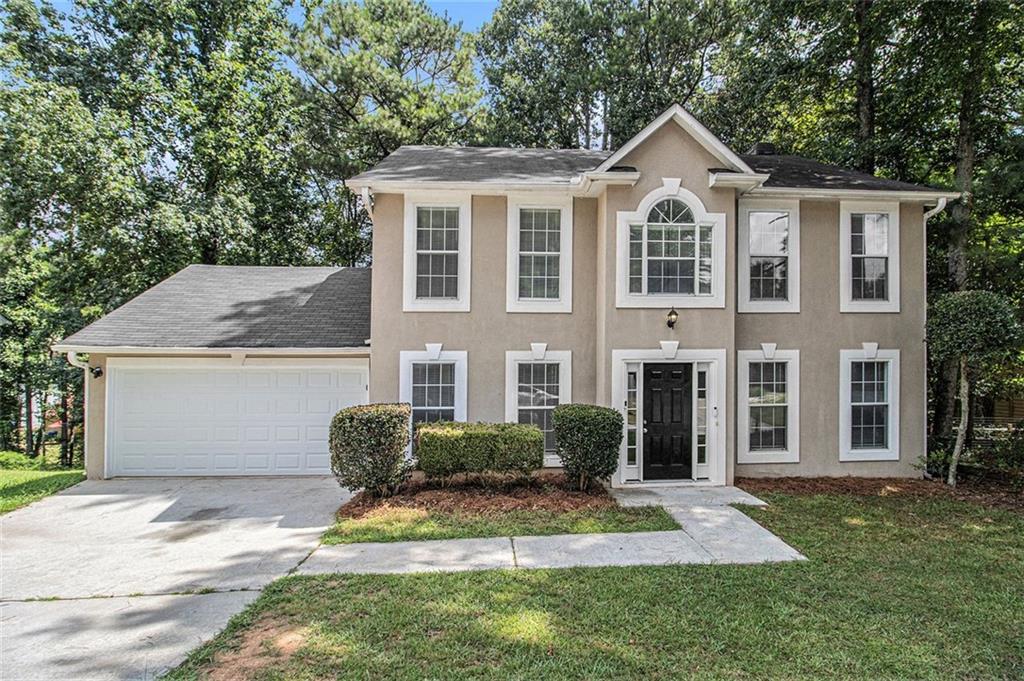 Spacious two-story single-family home featuring 4 bedrooms and 2.5 bathrooms. The interior offers a blend of luxury vinyl plank and carpet flooring throughout. The main living areas are designed with functionality and comfort in mind, providing plenty of space for everyday living and entertaining. The home includes a two-car garage for convenient parking and storage.