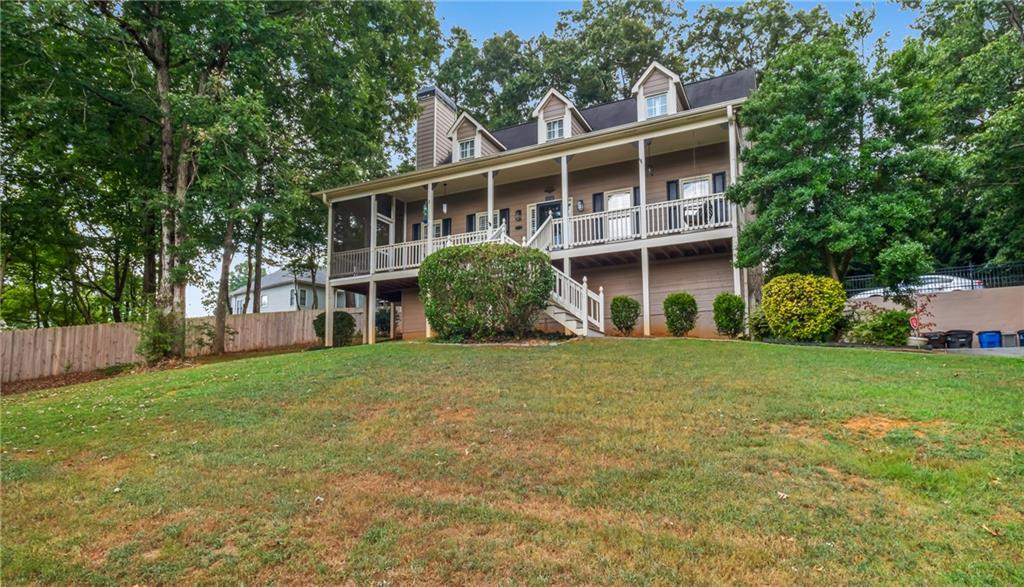 Looking for a million dollar view? Look no further, your next home is here! This charming Cartersville Cape Cod home has 4 bedroom 2.5 baths with a basement that could be used as your huge office, fitness center or movie room! Features of the home include a huge living room with vaulted ceilings, and a spacious custom kitchen filled with tons of cabinet storage. Enjoy your morning coffee on the expansive front porch that includes a screened in side, perfect for all seasons! The primary suite is on the main level with his & hers closets, custom vanities and an expansive his and hers shower. The 3 bedrooms upstairs are spacious and perfect for families who simultaneously love intimacy and privacy! The backyard features a chain link fence perfect for your dog(s) relay races and secluded enough to enjoy a book on the hammock! Share your favorite tales around the built-in fire pit or enjoy family BBQs on the huge back deck. This home has so many great features to mention! Schedule your tour today to discover all the beauty and charm in real time! Close to all of the top attractions in Cartersville including restaurants, walking trails and parks!