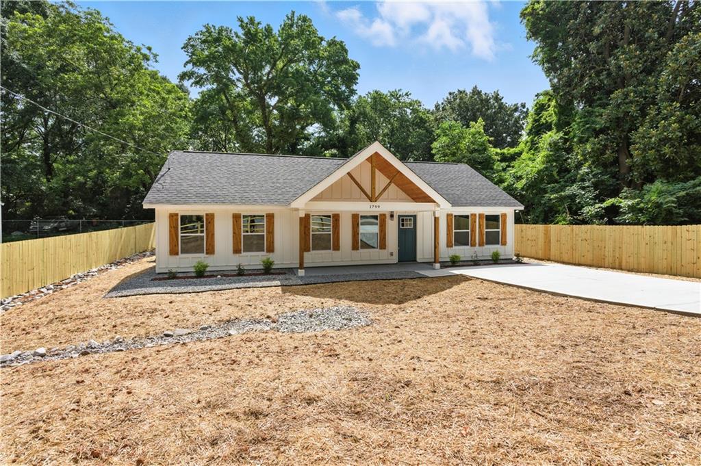 Welcome Home to 1799 Clearview St SE— A Brand-New Construction Filled With Style and Serenity
Step into a story of comfort, elegance, and modern charm — right in the heart of Marietta. From the moment you arrive at this freshly built home, the beautifully designed exterior with warm wood accents and a spacious fully fenced backyard sets the tone for what’s inside: a space made to inspire.
As you cross the threshold, you’re welcomed by clean lines, elevated finishes, and a seamless open floor plan. The heart of the home is the breathtaking kitchen — a true showstopper — featuring a quartz waterfall island with natural wood detail, statement pendant lighting, sleek white cabinetry, and stainless steel appliances. It’s the kind of kitchen that invites conversations, morning coffees, and memorable dinners.
The bathrooms carry a spa-like serenity, with marble-style tiles, matte black fixtures, and modern vanities that blend function with flair. Every corner of this home has been thoughtfully crafted — from the wide-plank flooring to the spacious bedrooms and the abundance of natural light that floods every room.
The fully fenced backyard offers a private haven — ideal for pets, family gatherings, or simply enjoying your own slice of nature.
And location? You’re minutes from Marietta Square, a vibrant mix of local shops, dining, parks, and cultural events. Spend your weekends at local farmers markets, walking trails, or exploring the rich history of this beloved area. Easy access to major roads makes commuting a breeze while still offering the quiet of a residential neighborhood.
This isn’t just a house. It’s where your next chapter begins — beautifully, comfortably, and completely yours.
Come experience the magic of 1799 Clearview St SE — and fall in love, room by room.