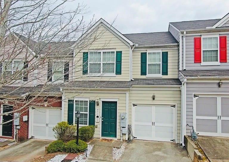 230 Valley Crossing is conveniently located off of Highway 575! This townhouse was built in 2006 in the beautiful subdivision of Hidden Springs. New hardwood floors have been added throughout the main floor. The second floor provides a roommate suite!! Each bedroom features vaulted ceilings, double closets, and personal bathrooms. The primary bathroom has a separate shower and tub and a double vanity. As a housewarming gift the seller has provided a washer and dryer along with other appliances to ease you into your new home. The community also has a community pool and two tennis courts for your enjoyment. The only thing missing is you!