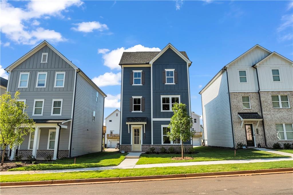 Brand new 4-bedroom, 3.5-bathroom home in the serene lakefront community of Madison at Buice Lake, just minutes from Downtown Woodstock, Target, Costco, Sam's Club, the Atlanta Outlet Shops. All appliances have WIFI enable controls! Washer/dryer included! The entry-level features a guest suite with a full bathroom. The main floor offers an open-concept layout with a spacious family room, dining area, and a modern kitchen equipped with an electric cooktop, built-in microwave, oven, and a brand-new refrigerator ideal for entertaining or relaxing at home. Upstairs, the expansive primary suite includes a walk-in closet and full bathroom, accompanied by two additional bedrooms, another full bathroom, and a convenient laundry area with an included washer and dryer. Enjoy outdoor living on the large deck, perfect for gatherings, and take advantage of the long driveway with ample parking for multiple vehicles. Residents also gain access to exceptional community amenities, including a clubhouse, pavilion, green spaces, walking trails, and pickleball courts, and swimming pools perfect for summer fun. WASHER AND DRYER INCLUDED