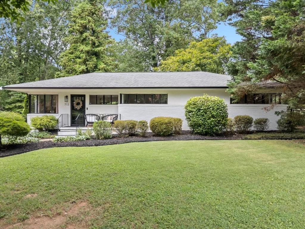 Discover timeless charm and modern sophistication at 713 Meadowbrook Ln NE, an elegantly updated ranch home just 1 mile from  the heart of Historic Marietta Square. Perfectly positioned on a quiet, established street, this single-level residence offers peaceful living with upscale details and a coveted location in the heart of one of Marietta’s most desirable communities. Step inside to experience a thoughtfully curated interior, where natural light fills the space and designer touches elevate everyday living. The open-concept layout features a custom electric fireplace, arched doorway, fresh paint, stylish flooring, and beautifully updated features throughout — all designed with comfort and style in mind. Enjoy seamless indoor-outdoor living with a private, fenced backyard ideal for entertaining, relaxing, or simply enjoying the serene surroundings. Located within the award-winning Westside Elementary School district. The location is unmatched. Just minutes away, you’ll find charming coffee shops, Michelin rated restaurants, local boutiques, and the beloved Marietta Farmers Market. Spend your weekends exploring the Square’s rich history, taking in a show at the historic Strand Theatre, enjoying community festivals under the oaks, or hiking Kennesaw Mountain that’s just minutes away. This is a MUST SEE!! Showings will begin Friday 8/8!