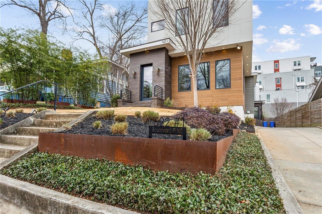 Tucked in the heart of Atlanta’s buzzing Old Fourth Ward, this show-stopping Jackbilt resale combines sleek modern luxury with unbeatable city living. Just moments from the Beltline, this stunning front-unit, 3 bedroom, 3 bath, duplex dazzles with light-filled interiors, wide-plank hardwood floors, and stylish finishes throughout. The gourmet kitchen is made for entertaining— stone countertops, a walk-in pantry, and a dramatic two-sided fireplace that connects seamlessly to the living room for cozy nights in. But the real jaw-dropper? A private rooftop sky lounge that’s nothing short of spectacular—Trex decking, a built-in outdoor kitchen, commercial ice maker, half bath, and panoramic views of Ponce City Market. Green thumbs will love the lush, landscaped front yard perfect for gardening, while the 2-car garage with custom-built storage loft keeps everything neat and tidy. Impeccably crafted, endlessly stylish—this is city living at its finest!