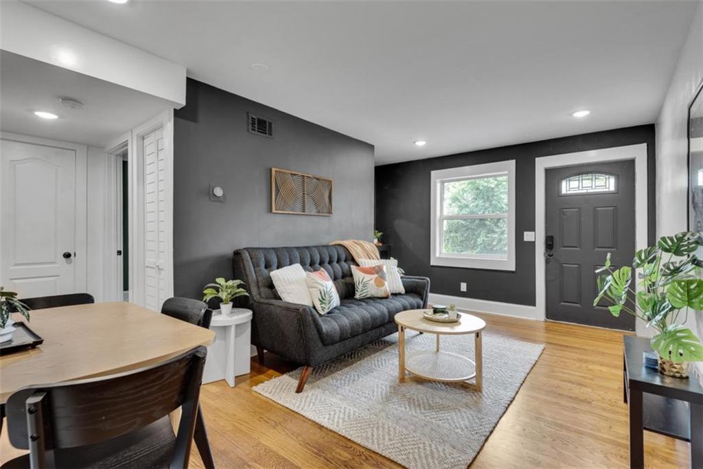 Welcome to easy, intown living in one of Atlanta's most beloved neighborhoods. Check out this charming, move-in ready condo in the heart of Grant Park. This freshly painted cutie is located on the top floor in a quiet 15 unit community just blocks from The Beltline, Grant Park, Zoo Atlanta, Oakland Cemetery, and some of the city's most delightful gems (I mean, have you tried Little Tart After Dark? It's DELICIOUS!), the weekend farmers market, Birdcage, and Cabbagetown are all just a short stroll away. Inside, enjoy hardwood and tile floors throughout, an updated kitchen with granite countertops and stainless steel appliances, and a modern bath. The open living and dining areas create a comfortable flow, and your private back door opens to a shared green space and dog run. Washer, dryer, and refrigerator all stay, making this one truly move-in ready. Off-street parking for you and your guests, easy access to MARTA and the interstate, and a close-knit community feel make this an ideal home base for enjoying all that intown Atlanta has to offer. This is a rare opportunity for affordable city living in a walkable, vibrant neighborhood. Come make yourself at home. This is a two bedroom unit. Additional photos added to show the many furniture configurations available to you when you move in!