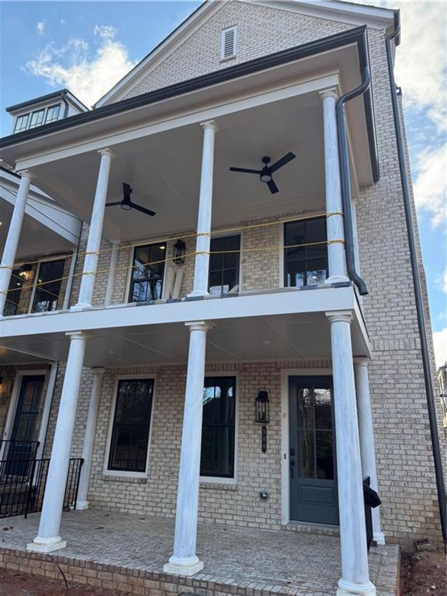 THE BEAUTIFUL NEW HOME IS MOVE IN READY! LOCATION, LOCATION, LOCATION!
Luxury is in every detail with Empire’s newest community located in one of downtown Alpharetta’s most prestigious addresses. Just steps from Avalon and a quick walk from the heart of downtown, in connection with the Alpha Loop, Empire Chiswick’s four districts impart an old-world feel and reflect a regal period of classic brick architecture. With shops, restaurants, and entertainment options all at your door, Chiswick is the sweet spot between historic charm and modern living, appealing to everyone no matter what stage of life they’re in. Much like the London district it’s inspired and named after, here is where the tranquility of the suburbs meets the energy of Atlanta’s urban core. Revel in semi-private courtyards and formal gardens when you own one of these 43 luxurious English-style 3- and 4-bedroom townhomes. The Harleigh plan features amazing details with an abundance of space.  This ELEVATOR READY home opens its doors for so much creativity!  The first floor features a bedroom perfect for an office or in-law suite with a full bath. The main floor features a spacious family room with fireplace opening out to your 2nd floor covered porch overlooking the city lights of Avalon, an oversized island large enough to serve as a buffet, a chef’s kitchen with high end stainless steel appliances, 42” stained/painted cabinets featuring soft close doors/drawers, walk in pantry that’s alongside the butler’s pantry, the dining room is perfect for your oversized dining table, and a tech area perfect for your drop off station. The 3rd floor features a generous Primary Suite with a large walk in custom designed closet, a spacious bathroom with luxury tiles, large walk in shower with bench and a lavish soaking tub. There is a laundry room and 2 secondary bedrooms that share a full bath.  THIS HOME IS MOVE IN READY.  This community is SHOWN BY AN EXCLUSIVE APPOINTMENT ONLY.  CALL TODAY TO SCHEDULE  AN APPOINTMENT TO SEE OUR BEAUTIFULLY APPOINTED MODEL HOME!