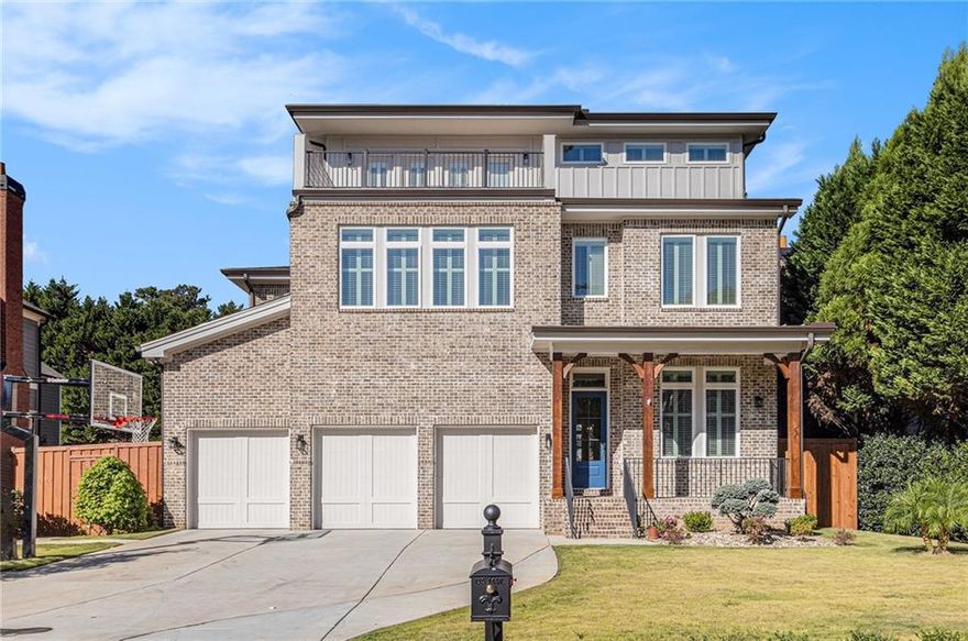 Modern Luxury in One of Atlanta's Most Desirable Neighborhoods. Discover the perfect blend of modern design, comfort and sophistication in this stunning newly-constructed home, completed in August, 2024. Situated in one of Atlanta's most sought-after neighborhoods and zoned for award-winning Ashford Park Elementary, Chamblee Middle and Chamblee Charter High, this residence offers not only luxury living, but also an exceptional location. From the moment you step inside, soaring 12-foot ceilings, plantation shutters and extensive trim and molding set a tone of refined elegance. Warm oak hardwood flooring flows throughout the main level, connecting the open living spaces with effortless grace. A versatile home office or guest bedroom, along with a secondary bedroom featuring its own private bath, offers flexibility for guests or remote work. On the second level, the primary suite provides a private retreat designed for rest and relaxation. Three additional bedrooms and a spacious bonus room offer plenty of room for family, hobbies or entertainment. The third level is an entertainer's dream - featuring two expansive rooms perfect for gatherings, media or recreation, along with two additional bedrooms, one with its own private bath. Step outside to the balcony for a peaceful escape and enjoy elevated views of the surrounding neighborhood. Outside, your private backyard oasis awaits. Gather with family and friends in the bright solarium, prepare gourmet meals in the full outdoor kitchen with sink area and large grill, or unwind in the beautifully landscaped garden area. For recreation, enjoy the home's unique putting greens, offering a one-of-a-kind touch of fun and relaxation. With a three-car garage, additional driveway parking, and an ideal location near parks, dining, shopping and major highways, this home delivers a lifestyle of convenience and distinction. Every detail has been thoughtfully designed to combine architectural beauty with everyday functionality. This is modern living at its finest - an exceptional home where quality, comfort and craftsmanship come together in perfect harmony.