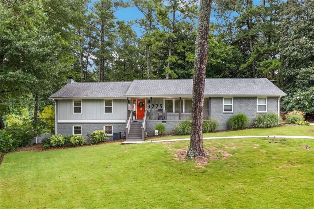 Discover this beautifully renovated all-brick mid-century gem tucked away in the peaceful North Hampton subdivision. Perfectly positioned in a quiet cul-de-sac, you’re just minutes from shopping, surrounding schools, Emory, and the CDC. With a two-car garage, ample driveway parking, and a partially fenced backyard, this home offers both convenience and charm.
Step onto the inviting front porch—perfect for your morning coffee or unwinding in the evening—and then inside to an open, flowing floor plan that’s ideal for everyday living and entertaining. Dazzling oak hardwood floors, a vaulted ceiling with stained beams, and a dramatic wall of window frame serene wooded views, creating a seamless connection to the outdoors.
The chef’s kitchen is a true centerpiece, featuring a hand-crafted walnut center island with an undermount sink, sleek quartz countertops, and premium stainless steel appliances. The main-level owner’s suite offers comfort and privacy, while two additional bedrooms share a stylish full bath.
The finished basement is a showstopper, boasting exposed white brick walls, a cozy fireplace, an entertainer’s wet bar, and a built-in wine fridge—perfect for hosting gatherings or enjoying quiet nights in.
This is casual living at its finest, blending mid-century character with modern updates. You have to see it to truly appreciate it!