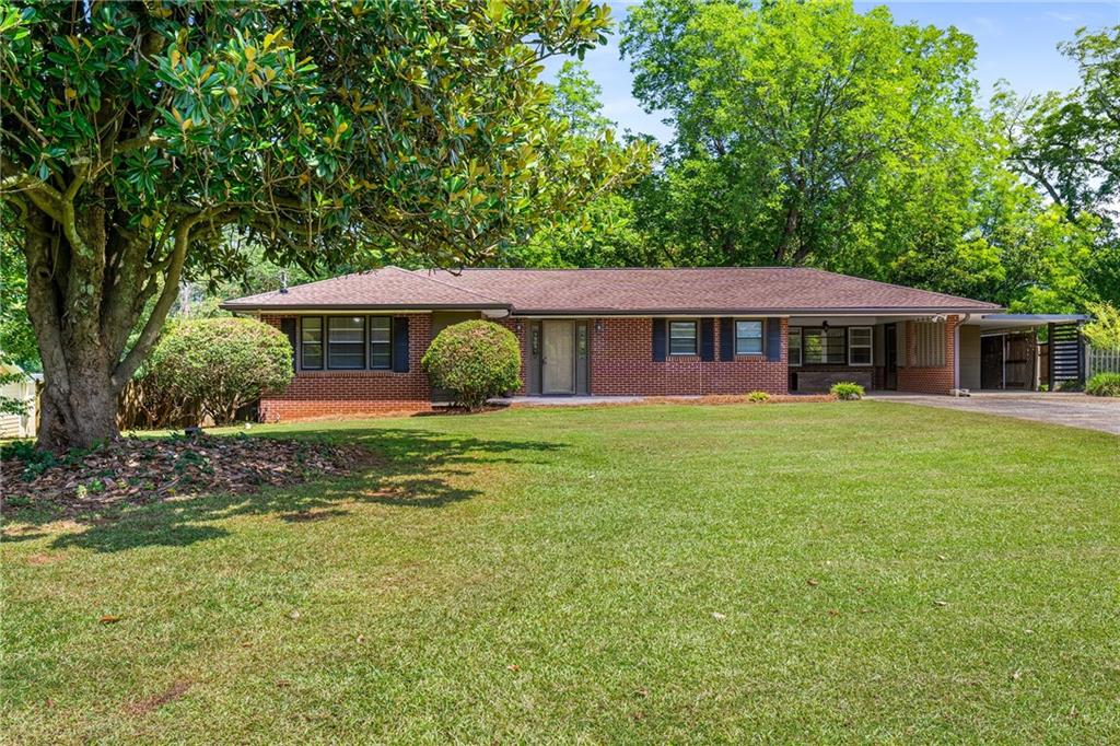 CALLING ALL DIYers and INVESTORS!! – Incredible opportunity to purchase a “fixer upper” with a separate heated and cooled +400 sq ft accessory building on a large (.75 acre) level lot with a private backyard. Property is offered “AS IS” - build immediate equity by making your own updates/upgrades! House is a mid-century (1956) 3BR/2 BA all-brick ranch with hardwood floors, an open concept kitchen with views to the dining and living rooms and an enclosed sunroom overlooking the private backyard. Home sits on a LARGE (.75 acres) LEVEL LOT. Roof on house and the detached accessory
building were both replaced in 2023. This is the best investment opportunity within 5 miles!