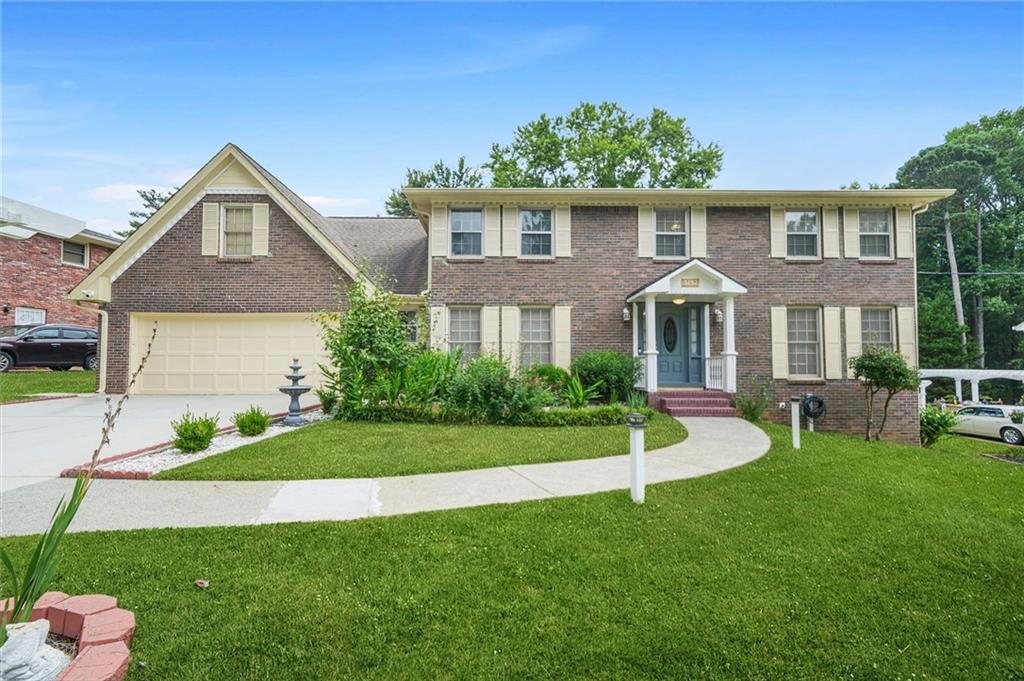 Situated in the well-established Summertown community—known for its stability and charm and with a character that feels more like Lilburn—this beautifully maintained 4-sided brick home offers 4 bedrooms, 2.5 baths, and a versatile bonus room that has been transformed into a full home theater. Freshly painted interiors, gleaming hardwood floors, and an open kitchen with quartz countertops create a bright and inviting atmosphere. The kitchen flows seamlessly into the breakfast area and cozy family room with a fireplace, while the separate dining room is ideal for gatherings. The upstairs home theater comes complete with a Pioneer surround sound system and projector, perfect for immersive movie nights. Step outside to a screened-in porch overlooking the fenced backyard, providing year-round enjoyment. The full, unfinished daylight basement offers endless possibilities for future expansion. Conveniently located minutes from Amazon, Stone Mountain Freeway, shopping, dining, and entertainment—with Stone Mountain Park, Emory University, and Downtown Atlanta all within easy reach—this move-in-ready home blends comfort, convenience, and community charm.