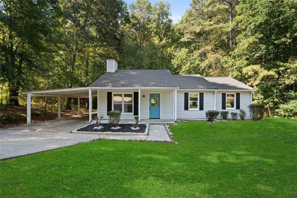 Welcome home to this charming ranch nestled on a spacious 1.9-acre lot with plenty of room to enjoy inside and out. Step into a bright and inviting layout with a cozy fireplace and a kitchen offering great counter space and functionality. The covered carport adds convenience, while the backyard is perfect for relaxing, entertaining, or creating your own outdoor retreat. With a peaceful setting and easy access to nearby amenities, this home offers the ideal blend of comfort and location.