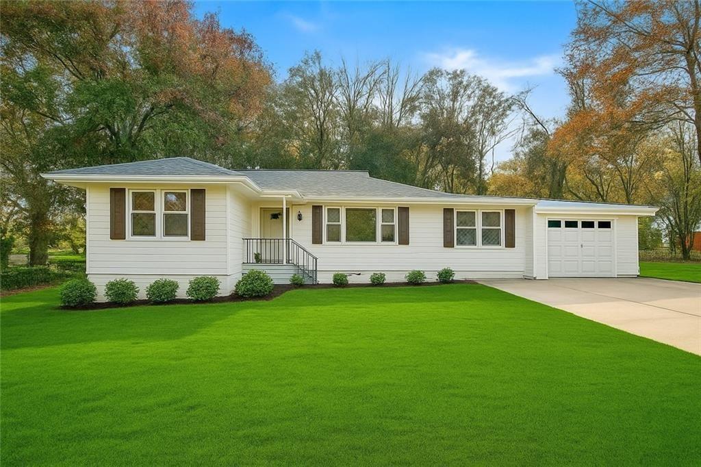 Welcome to this beautifully updated 3-bedroom, 2-bath ranch home, offering modern comfort and convenience in a prime location! Every inch of this home has been thoughtfully remodeled, featuring a sleek and stylish interior with all-new systems, including HVAC, plumbing, and electrical, for worry-free living. The open-concept living and dining area boasts contemporary finishes and gorgeous flooring throughout. The updated kitchen is equipped with stainless steel appliances and offers plenty of storage and functionality. This home also features a versatile bonus room, perfect for a home office, sitting room, or play area. The private backyard provides a cozy outdoor space ideal for relaxing or entertaining. Enjoy the convenience of an attached garage for parking and storage, and a location that’s just minutes from the city, shopping, and dining. This move-in-ready gem is waiting to be your home!