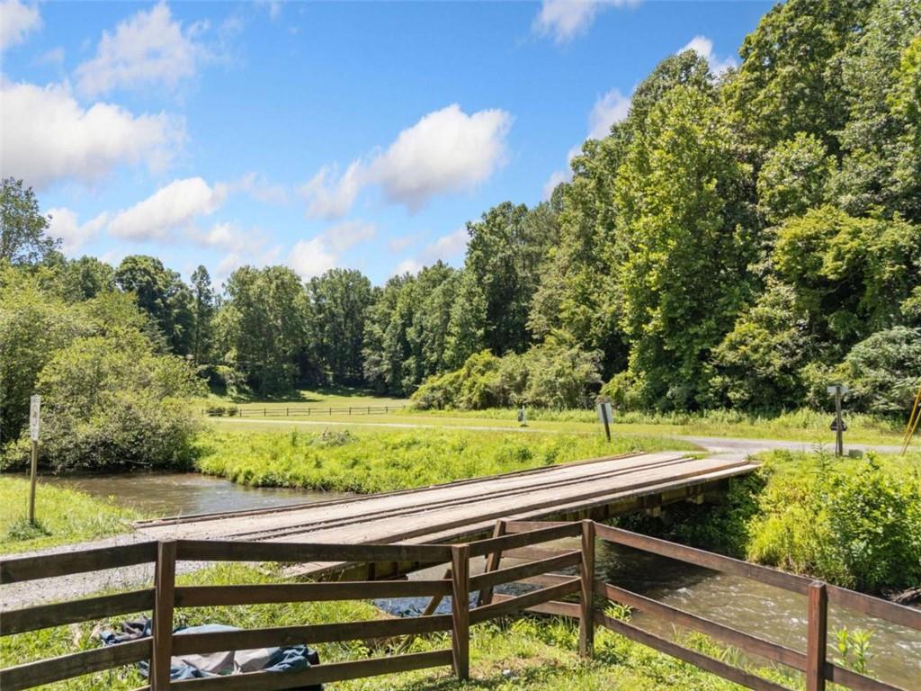 3.18 Unrestricted Acres in Ellijay, GA
Discover unmatched serenity and seclusion on this 3.18-acre wooded parcel in the heart of the North Georgia mountains. Surrounded by mature hardwoods and the peaceful sounds of nature, this property offers the perfect opportunity for a private mountain retreat, full-time residence, or short-term rental investment.
With no HOA and no restrictions, you'll have the freedom to bring your vision to life—whether that's building a custom home, placing a cabin or tiny house, or simply enjoying the natural beauty as a weekend getaway. The land features a mix of gentle terrain and rolling hills, offering multiple potential build sites with mountain views.
Located just minutes from downtown Ellijay and its renowned apple orchards, you’ll also enjoy convenient access to hiking, fishing, vineyards, and other outdoor recreation. Despite its private, tucked-away feel, the property is easily accessible and close to modern amenities.
Don’t miss this rare opportunity to own a beautiful, unrestricted parcel in one of North Georgia’s most sought-after locations—priced below appraised value and ready for your dreams.