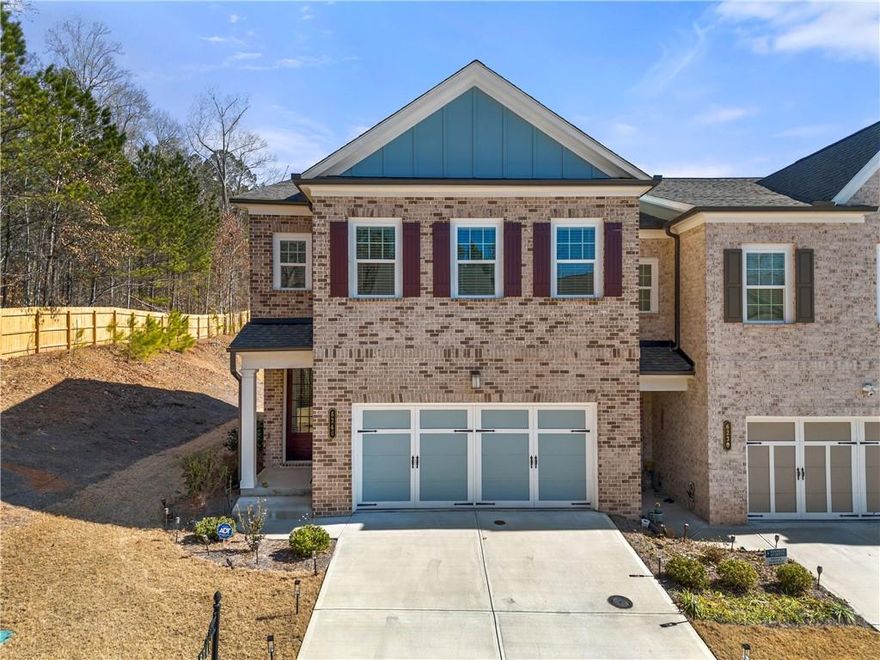 Welcome to this rare End-unit Townhome located in gated swim community of Magnolia Walk. This beautiful and well maintenance 3 bedroom and 2.5 bathroom home offers open concept living perfect for entertaining and relaxation. Main level features gourmet kitchen with white cabinets, quartz countertops, stainless steel appliances and a large island opening up to the spacious and bright family room with fireplace and breakfast area overlooking backyard with covered patio. Second floor features spacious master suite, ensuite bathroom with walking shower, double vanities, and a walking-in closet. Additional two bedrooms, full bathroom, laundry room and a spacious loft area completes second floor. Conveniently located minutes away from GA 400, shopping, restaurants and parks including Halcyon, Avalon and Fowler Park. The HOA covers all amenities, exterior building, lawn maintenance and trash. 
Alpharetta address with Forsyth county taxes tops everything this beautiful has to offer.