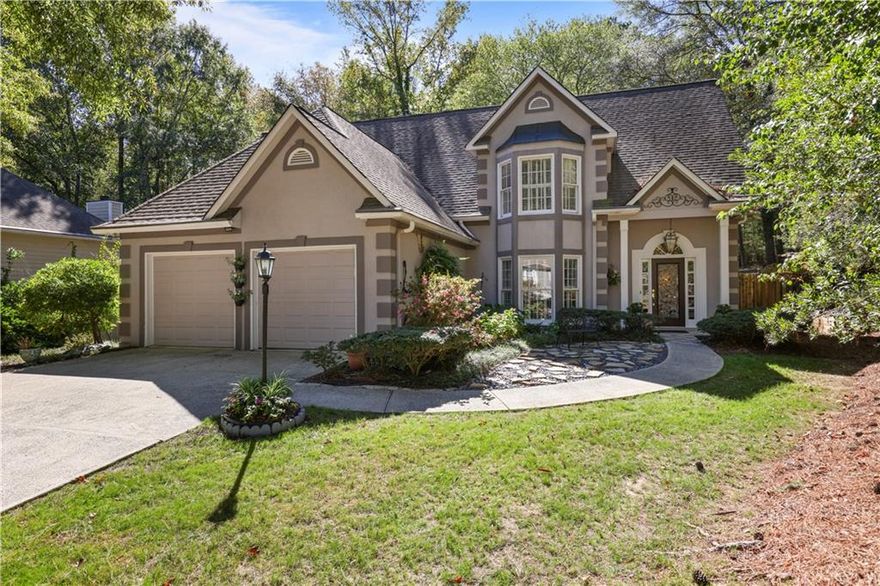 Welcome Home! This beautiful, well-maintained traditional home situated on 1/2+ acres has it all! Kennesaw Battlefield National Park right out the back door, close to bustling Marietta Square, and located in highly sought after Lee's Crossing with its quiet neighborhood streets, sparkling Swim/Tennis facilities and all its fabulous amenities!  The first floor boasts a spacious primary suite with 2-tiered tray ceiling, double vanity, garden tub, separate shower and ample walk-in closet. A lovely Eat-In Kitchen with updated granite countertops opens to the light filled Great Room. The Dining room features a striking bay window with plantation shutters. A trip up the gorgeous extra-wide staircase to the second floor reveals stunning view down into the great room and front entrance areas. Upstairs you'll find a versatile Sitting Area/Family Room and 3 large Bedrooms and Guest Bath. Take a walk outside to experience the great outdoors where relaxation awaits on your gorgeous wood deck, in your private, fenced backyard! Proceed to the back of the yard to your private entrance to Kennesaw Battlefield National Park and miles of beautiful, wooded hiking trails. Truly a wonderful place to call home!