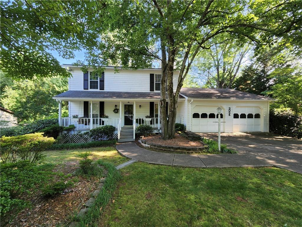 Highly-rated Pope High School home in a prime location with a beautifully landscaped, fenced yard. NO HOA! Newer roof, upstairs flooring, deck and exterior paint. The full basement includes workshop space and a third garage. Close proximity to schools, art center, aquatic center, library, shopping, dining and parks. This wonderful estate property has great bones and is ready for your personal touch. One-year HSA Home Warranty included with purchase.