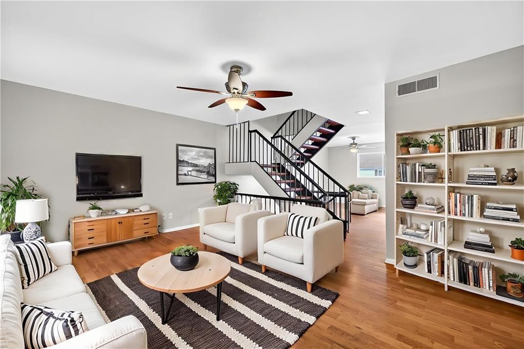 Welcome to this spacious three-level townhouse in the heart of Sandy Springs, offering both modern design and versatile living spaces. You are greeted by a main level that boasts an open-concept layout with seamless flow between the living, dining, and kitchen areas—perfect for entertaining or everyday living. The central staircase adds a great architectural detail! Enjoy a bright, functional kitchen featuring stainless steel appliances, granite counters, and generous counter space—perfect for both everyday cooking and hosting. Head upstairs to find three well-appointed bedrooms, including a primary suite featuring a large walk-in closet, private balcony overlooking a tranquil tree line and a primary bath with new, modern vanity. The two upstairs secondary bedrooms are spacious with tons of natural light and share a full bathroom that has new flooring and new vanity. Enjoy upstairs laundry for added convenience! The fully finished terrace level is a standout feature, complete with a wet bar and wine fridge, oversized family room, and an additional bedroom with full bath! This level offers the perfect setup for a guest suite, home office, or mother-in-law suite. Step outside to your private enclosed patio, offering plenty of space for outdoor dining, relaxation, and entertaining. Two covered parking spaces adds convenience, while the community amenities—including swim, tennis, and clubhouse—create a resort-style lifestyle right at home. Located in a quaint, tucked away community while still being close to I-285, GA-400, Perimeter Mall, Downtown Sandy Springs, and tons shopping/restaurants this home puts the best of the city right at your doorstep! Rental permits available!