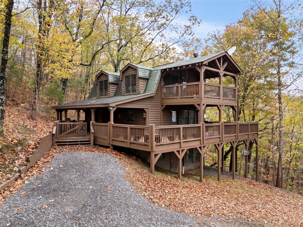 Fully furnished cabin that is ready to just move in within the gated community of Talking Rock Creek Resort. This property includes all utilities, lawncare and pest services. Short term rental, minimum 14-day rental. Perfect for people caught between homes such as an insurance claim or temporary living. Cleaning fee $350 upon departure. If you have a pet let's talk because we don't want to not allow your pet, but we need to make sure this cabin is a good fit for your pet. Active community neighborhood watch program in place. Nice, bubbly hot tub on the main level deck. Second level deck with swing to overlook the wildlife. Enjoy making s'mores in the outdoor firepit. Close to Carters Lake. Lots of wildlife to see. Pets allowed with limitations