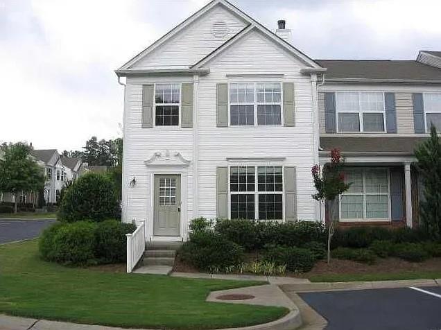 Corner lot, end unit townhouse with open floor plan in a very sought-after community close to Windward Parkway. Within 2 miles of Halcyon with lots of shopping and restaurants, and GA.400. Great schools, hardwood floors in every room, carpet on stairs, stained cabinets, refrigerator, dishwasher, microwave, and washer/dryer. Freshly painted interiors. 2 assigned parking spots. Two swimming pools in the community. No rental restrictions. Perfect home for residents and investors alike.