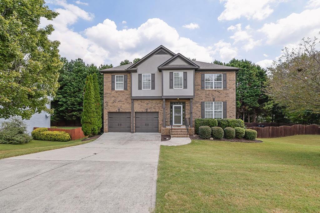 Stunning 6-Bedroom, 3.5-Bath Southern Charmer in Mineral Springs Crossing! Welcome to one of the largest and most impressive homes in the highly coveted Mineral Springs Crossing community! From the moment you step inside the inviting entry foyer, you’ll feel right at home. A formal dining room and additional flex space—perfect for a home office—set the tone for versatile living. The spacious family room features plush luxury carpet and a gorgeous stone fireplace, ideal for cozy movie nights. An open view to the kitchen keeps you connected with guests while entertaining. The chef’s kitchen offers abundant cabinetry, a center island for cooking or extra seating, and sleek stainless-steel appliances. Step outside to a large deck with tranquil lighting—your favorite spot for morning coffee or evening mocktails. Upstairs, prepare to be wowed by the oversized primary suite! This retreat boasts a striking trey ceiling, generous sitting area, and a spa-like en-suite with a custom-tile luxury shower, soaking tub, double vanity, and walk-in closet. Four additional bedrooms and extra bathrooms provide space for everyone. The fully finished basement is a dream for multi-generational living or rental income. Complete with its own entrance, full kitchen, living and rec areas, flex space for a gym or media room, a sixth bedroom, full bath with step-in shower, laundry with stacked unit, and large walk-in closet—this level has it all. BRAND NEW ROOF 9/3/25! Enjoy the covered flagstone patio for summer BBQs or cozy bonfires. Set on a large lot with a spacious backyard, side yard, and two storage sheds, this property truly has it all. Located in sought-after Auburn, close to schools, shopping, and dining—don’t miss your chance to own this exceptional home. Schedule your private showing TODAY!