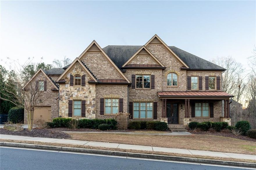 Located in the prestigious gated community of Kingsley Estates and within the top-rated Cambridge High School district, this exquisite home offers over an acre of private property and a thoughtfully designed floor plan that seamlessly blends style and function. The heart of the home is the oversized kitchen, which is truly a chef's dream. It features a new backsplash, Thermador stainless steel appliances, wine and beverage fridges, and a hidden walk-in pantry. This open kitchen flows effortlessly into two stunning living areas—a grand family room with coffered ceilings, bookcases and a wall of windows, and a cozy keeping room with a stone fireplace and vaulted tongue-and-groove ceilings. Both spaces provide abundant natural light and direct access to a screened porch and deck that overlook the spa-like pool and hot tub. The level, grassy yard, surrounded by mature trees, offers unparalleled privacy and tranquility. The main level also includes a mudroom off the three-car garage for added convenience, a separate office, an en-suite guest room, dining room and butler's pantry. Upstairs, the primary suite is a luxurious retreat, featuring trey ceilings, his-and-her expansive walk-in closets, and a renovated spa-inspired bathroom. Secondary bathrooms throughout the home have been updated with marble vanities, and new lighting fixtures add a modern touch. The terrace level has been completely transformed into a fully functional apartment with private access. It includes a second kitchen, two bedrooms, one bathroom, tons of living space and a second laundry room, making it ideal for guests, multi-generational living, or rental income. With updates such as replaced windows and abundant built-in storage, this home combines timeless craftsmanship with modern amenities. The expansive lot, open layout, and serene outdoor spaces make it perfect for both entertaining and everyday living. Don’t miss the chance to own this exceptional property in Milton—schedule your private tour today!