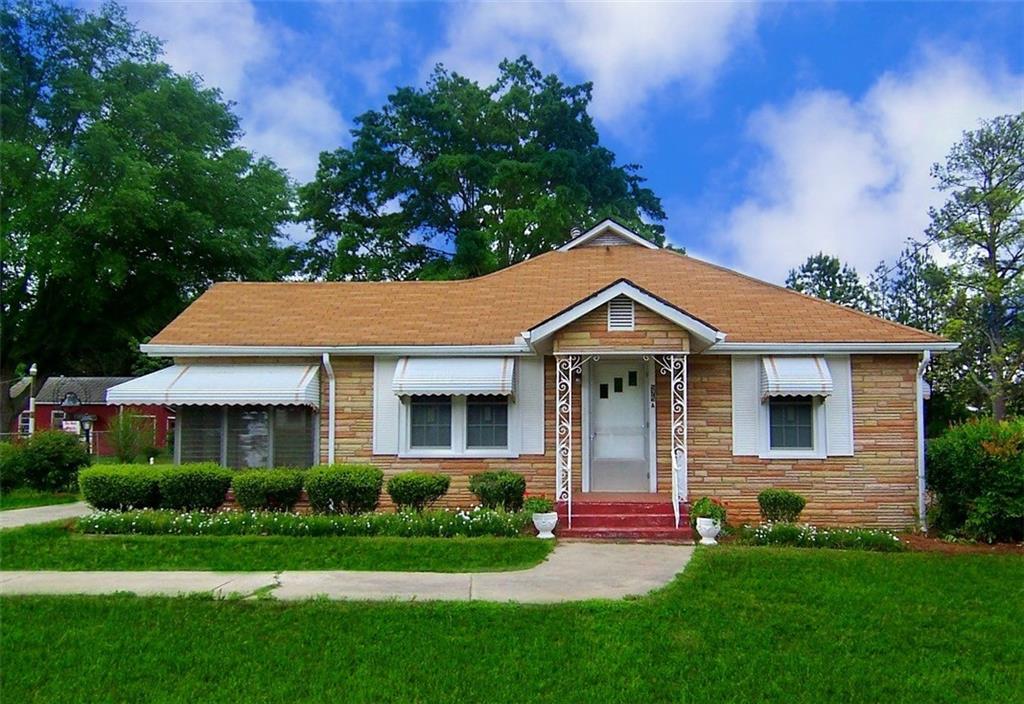 Adorable mid-century modern bungalow in the heart of Lawrenceville. 2 bedrooms, 1 bathroom. Enclosed porch, mudroom off of kitchen, covered parking carport. Walk to downtown Lawrenceville in less then 1 mile! Fenced in backyard - dogs allowed, but no cats due to owner's severe cat allergy. Original hardwood floors, doors, and all the charm! You won't find a better deal around Lawrenceville! Tenant responsible for $150.00 monthly landscaping maintenance as well.