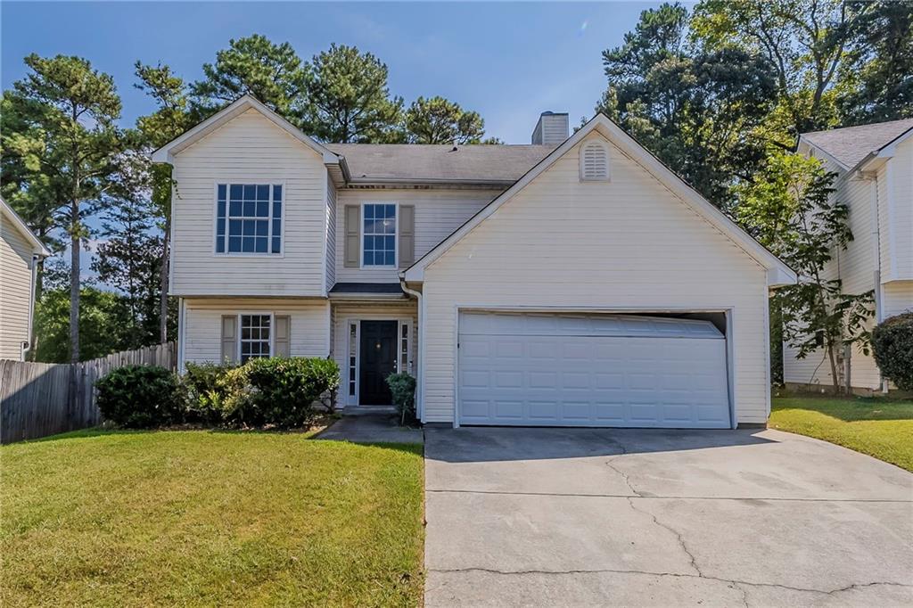 Spacious two-story home featuring 2 bedrooms, 2 bathrooms, and a 2-car garage. Enjoy a cozy fireplace in the living room and a kitchen with a convenient bar and pantry. The primary suite includes a double vanity, and the wood-fenced backyard provides ample space for outdoor living. One or more photos have been virtually staged. Schedule a showing today!