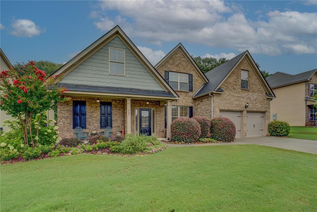 Welcome to your dream home! Nestled in the Birchwood Place subdivision, this 2,747 square foot home built in 2015 offers luxurious living with modern conveniences. As you arrive you are greeted by a charming covered front porch. Upon entering the home, you will be delighted by the soaring ceilings and wide-open spaces. To your right is the main dining area with coffered ceilings. The dining room is generously sized and perfect for large family gatherings. Entertain guests in the spacious family room with a cozy fireplace. The family room opens to the large chef's kitchen where you can fulfill your culinary dreams. The large kitchen boasts an oversized center island with granite countertops, top of the line stainless steel appliances, double convection ovens, and generous amounts of storage. The kitchen also contains an additional eat-in area. The lower level houses the main retreat with oversized bedroom, relaxing sitting area, and large ensuite with separate tub and shower, large walk-in closet, and double vanity. The main floor has an additional half bathroom, a dedicated laundry room, and additional storage to enhance the functionality of this home. Enjoy elegant ceramic tile flooring in key areas for a refined look. The second floor contains three generously sized bedrooms, with ample closet space, and are complemented by two full bathrooms, ensuring comfort and convenience for everyone. The second floor offers tons of additional storage space as well. The home has recently had brand-new carpet installed and fresh paint throughout. The outside space offers not only relaxation but privacy. Step outside to a covered back patio perfect for relaxing, gardening, and entertaining, all within a secure, fenced backyard. The property includes a home warranty for additional peace of mind. This home is located within easy access to major highways, entertainment, schools, shopping, and beautiful parks and recreation. This home is not just a place to live; it is a lifestyle. Schedule a viewing today and imagine yourself enjoying all this exquisite property has to offer!