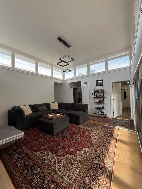 Completely renovated mid century modern condo. This is a prime Buckhead location located next to Chastain Park and in close proximity to Phipps plaza, Lenox mall and fine dining. The living room has 14' ceilings and the back wall has floor to ceiling windows and glass doors opening to an over sized deck which overlooks the tree lined spacious dog park. LVP floors are throughout the unit and the kitchen is equipped with Samsung Bespoke appliances. Each bedroom has its own en-suite. One bathroom has double vanity and a soaking tub and the other one has a walk in shower. Skylights also allow a natural abundance of sunlight. The condo is an end unit and has 2 parking spaces.