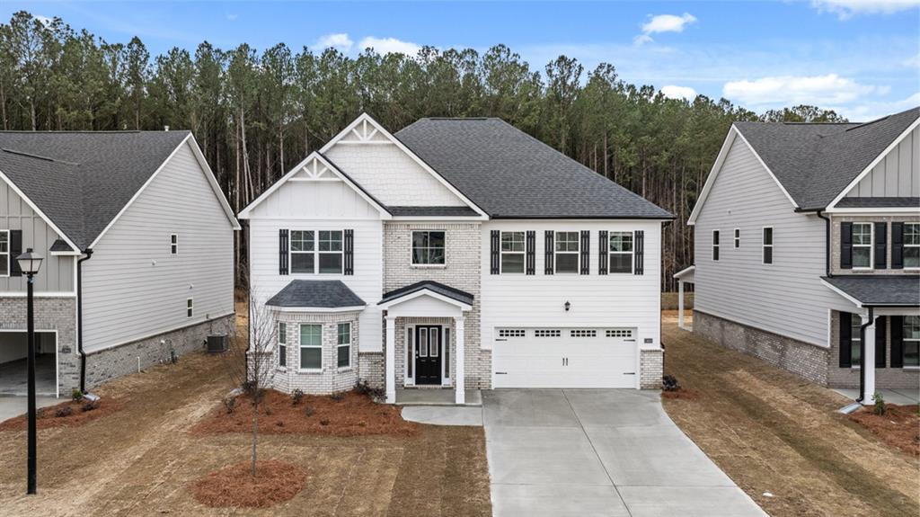 Minutes from I-20. Clubhouse, swimming pool, tennis courts, walking trails, sidewalks. Up to 3% in Seller Paid Closing Costs and special financing with preferred lender. Abigail floorplan. Expansive island kitchen with extended bar opens to a huge family room with fireplace. Cabinet color options include gray, white and brown. Dramatic two-story foyer opens to formal living and formal dining, ideal areas for entertaining. Upstairs offers a spacious bedroom suite with spa like bath and room for seating. There is room for everyone with large secondary bedrooms and laundry is also conveniently up. And you will never be too far from home with Home Is Connected. Your new home is built with an industry leading suite of smart home products that keep you connected with the people and place you value most. Photos used for illustrative purposes and do not depict actual home. Call today to view our beautiful grounds and flat, leveled lots, located just miles from I-20 with quick access to Downtown Covington, Atlanta and Augusta.