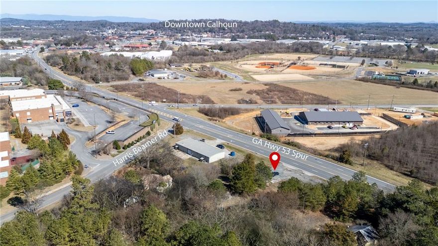 Undeveloped Lot located on a busy thoroughfare, Hwy. 53 Spur. Need someone to be creative in type business you can locate on this lot. Located in the County of Gordon but abuts Calhoun City limits, near the Georgia Northwestern Technical College, New Calhoun GBI Building, Calhoun Police Station, the Calhoun Engneered Floor Mfg. Plant; The Yellow Jacket Diner, several residential subdivsions ie. Brookstone, Madison Gardens, Westlake Village, King's Pointe. Fantastic location for any type business, etc. Check this out today!!!! Don't miss out on a "Sleeper".