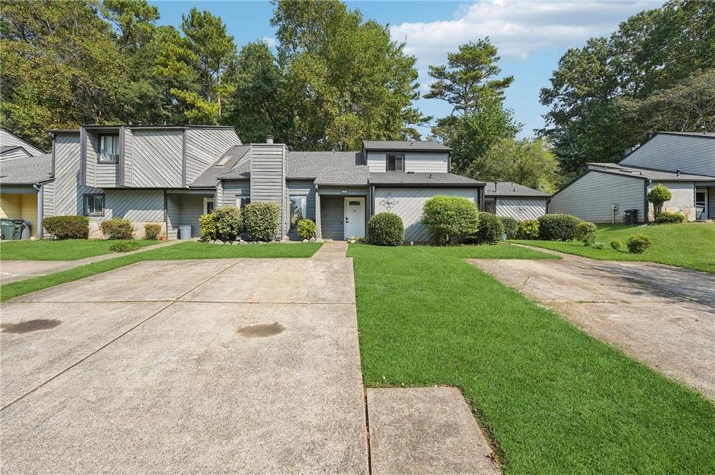 Just minutes from Marietta Square, this established townhome community offers the perfect blend of convenience and comfort. You’ll be close to shopping, restaurants, and highways, plus only a short stroll or bike ride to Tumlin Park.
Inside, the spacious layout features an oversized living room anchored by a beautiful masonry fireplace. Both bedrooms are located upstairs, giving each plenty of privacy. The home also provides generous closet space and an additional storage closet for extra functionality.
Step out back to enjoy a comfortable deck overlooking a yard that’s ideal for gardening or relaxing outdoors. The design works well for nearly any living situation, whether for roommates, a family, or an individual looking for a flexible setup.
No rental restrictions, voluntary HOA, and a prime location near Historic Marietta make this a fantastic value.