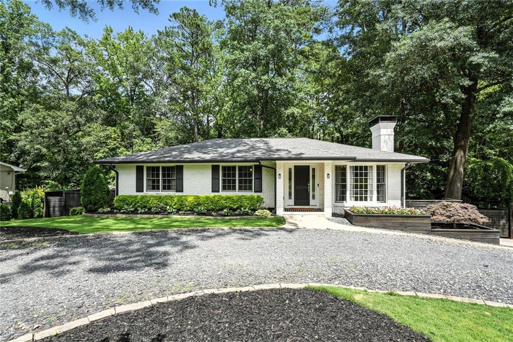 This picture-perfect ranch home blends classic charm with modern upgrades, all nestled in the peaceful, well-established neighborhood of Piedmont Hills. From the moment you arrive, you’ll fall in love with the curb appeal- fresh landscaping, a wrap around gravel driveway, and timeless brick exterior make this home a true standout. Step inside to discover a completely renovated interior with thoughtful finishes throughout. The main level features a bright, open layout with versatile spaces designed to fit any lifestyle, including a fireside living room, dining area, and a sunroom ideal for a home office, play room, or flex room. The heart of the home is the stylish kitchen with stainless steel appliances, quartz countertops, a large island, and tons of custom cabinetry. The primary suite on the main level features an en-suite bath with dual vanity, large tile shower, and custom closet. Downstairs, the finished basement is a dream setup for an in-law suite, rental income, or extended guest space, complete with its own private entrance, bedroom, full bath with marble vanity, living area, kitchen, dedicated laundry, and plenty of room to spread out. Step outside through the enclosed back patio ideal for unwinding and entertaining where you’ll find a fully fenced terraced backyard complete with play set and hammock. This home checks every box—move-in ready, low-maintenance, and full of possibilities—all tucked in a quiet neighborhood that feels like home from the moment you arrive. All that’s missing is you- welcome home! Some photos have been virtually staged to help conceptualize the space.