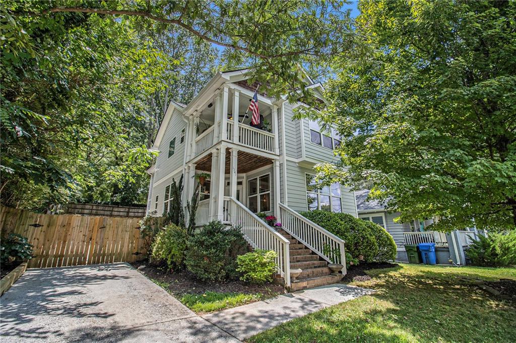 Step into this charming Craftsman-style retreat, where classic charm meets modern comfort and a vibrant community lifestyle. As you enter, you're welcomed by an open-concept main level adorned with rich hardwood floors, perfect for both everyday living and entertaining. The inviting living room features a cozy fireplace—lots of light and ideal for relaxing evenings with friends or curling up with a book.
The kitchen is easy for a cook to work his/her chef magic as everything is close and easy to function with the amount of granite countertop space, stainless steel appliances, and a convenient breakfast bar that makes casual meals and morning coffee a breeze. Easy access to the 2 car garage with extra storage space, just off the hall at the kitchen level.
Upstairs, the spacious primary suite is a true sanctuary, complete with vaulted ceilings, a walk-in closet which provides generous storage, ensuring your space remains organized and clutter-free, and a private covered balcony—your personal perch to sip coffee or unwind as the sun sets.
The luxurious primary bathroom features a classic clawfoot tub and a separate glass and tiled shower The large double sink vanity provide great storage for each side. A secondary bathroom with a tub-shower combo is just down the hall, perfect for guests or family. The 2 secondary bedrooms are spacious and have lots to offer. The home also includes a privacy fence from the street to the extra large two-car garage which provides plenty of space for both vehicles and extra storage.
Step outside the garage onto the patio and up a few steps to the long wood deck. This takes you into your private, fenced-in backyard—Weekend barbecues, morning yoga, or letting pets play freely is all at your fingertips here. With fresh interior and exterior paint, plus a newer roof and gutters, this home is truly move-in ready.
And best of all, you're just minutes from the energy of the Atlanta BeltLine—enjoy morning jogs or bike rides through nearby parks, pop into eclectic shops, or meet friends for drinks and dining at one of the many vibrant local spots. Whether you crave peace at home or the pulse of the city, this home offers the best of both worlds.