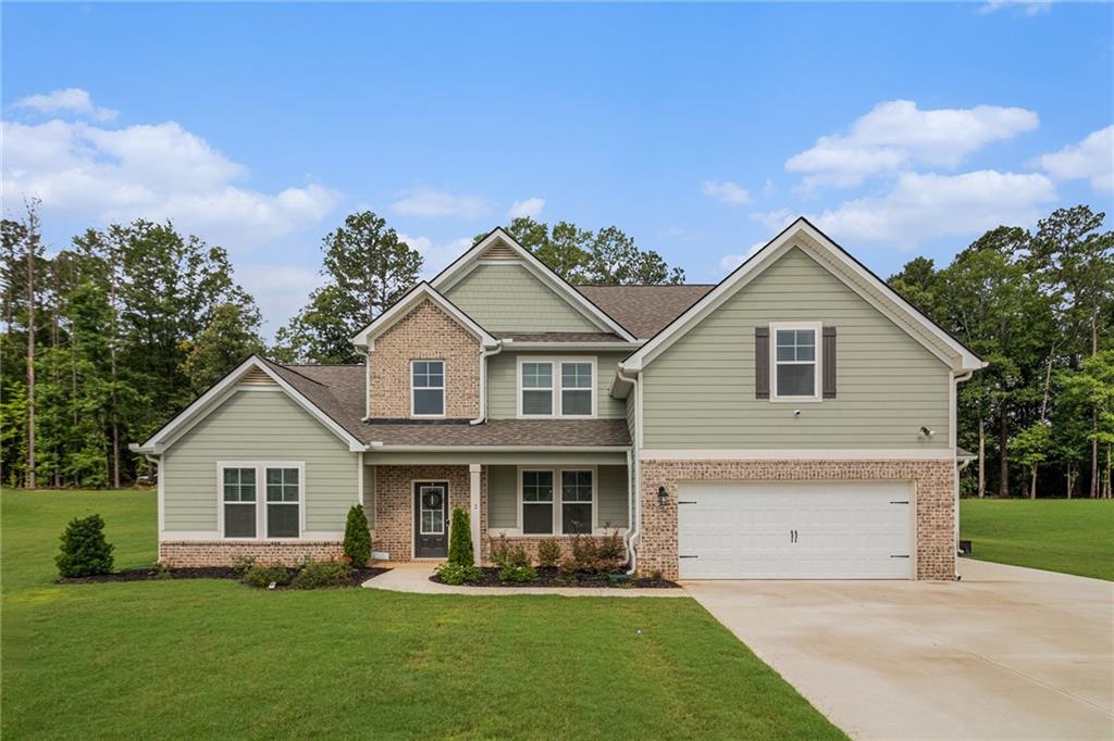 Welcome to the Henry II by DRB Homes, located in the desirable Mill Pond community!
This stunning 5-bedroom, 3.5-bath home offers a spacious and thoughtfully designed layout, perfect for modern living. The main floor features a luxurious owner's suite with a spa-inspired en-suite bath, complete with tile flooring and a freestanding soaking tub for ultimate relaxation.
Enjoy seamless flow throughout the main level with durable luxury vinyl plank flooring (bedroom excluded), a gourmet kitchen equipped with stainless steel appliances, a cooktop with microhood, double wall ovens, quartz island, and beautifully painted cabinetry. The inviting great room includes a cozy fireplace—ideal for gatherings or quiet evenings. Upstairs, you'll find a versatile media room perfect for movie nights, gaming, or a home office. Step outside to a covered back porch, great for entertaining or enjoying peaceful mornings, and take advantage of the convenience and storage offered by a spacious 3-car garage. Additional features include exterior floodlights for added security and charm. Don’t miss the opportunity to own this exceptional home that blends luxury, comfort, and style!