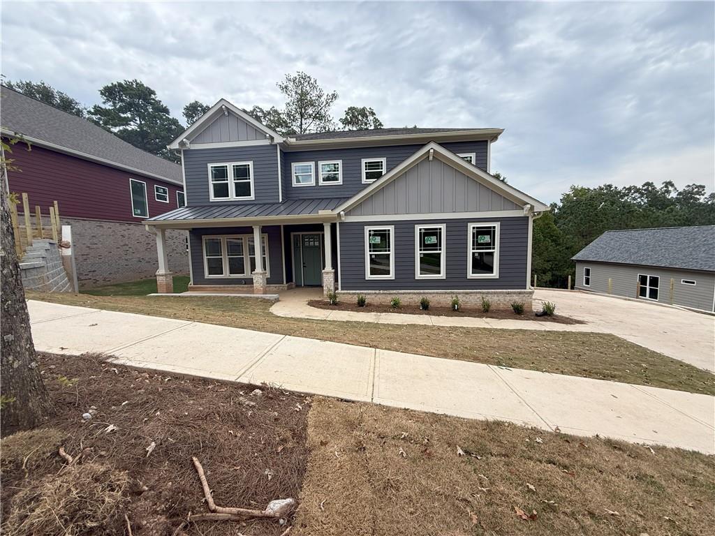 Professional photos coming next week. Showings will open up on 9/9/25
Seller and preferred lender are contributing to buy down your rate to 4.99%for qualified buyers! Plus, enjoy peace of mind with a 2-10 home warranty. Even better — homes of this quality are typically priced at least $20 more per square foot, making this an incredible value opportunity. Seller also has 6 additional lots available in Tributary at New Manchester 4 of which have not started construction yet and 5 homes under construction in Tributary at The Villages. Step into refined living at this two-story modern craftsman, where thoughtful design meets luxury finishes. A dramatic two-story family room welcomes you with natural light, open flow, and stunning details, while the formal dining room adds elegance for gatherings. The chef’s kitchen features an oversized quartz island with sink, 8-foot tall cabinets, stainless vent hood, tile backsplash, pendant lights, and a butler’s pantry. Wide plank wood flooring, 10-foot ceilings, and 8-foot doors throughout complete the upscale feel. This home is designed for flexibility and multi-generational living with junior master/in-law suite on the main level with its own washer/dryer hookups and private balcony. You also have an upstairs master retreat with his & hers bathrooms, a large flex space, and your own private balcony. Every bedroom is oversized with spa-inspired ensuite baths featuring quartz counters, frameless glass showers, anti-fog mirrors, and tile showers. Additional highlights include a tiled laundry with sink, LED lighting, a private rear deck, and an unfinished basement stubbed for a bath, ready for your custom vision. Set on a .38-acre lot near Lions Gate in Douglasville, the Tributary subdivision has sidewalks, community swimming pool with tennis courts and playground. Located minutes away you have golf, shopping, Sweetwater Creek State Park and hiking. Driving to Atlanta is an easy commute.
Luxury, multi-generational flexibility, and unbeatable value — all in one remarkable home.
