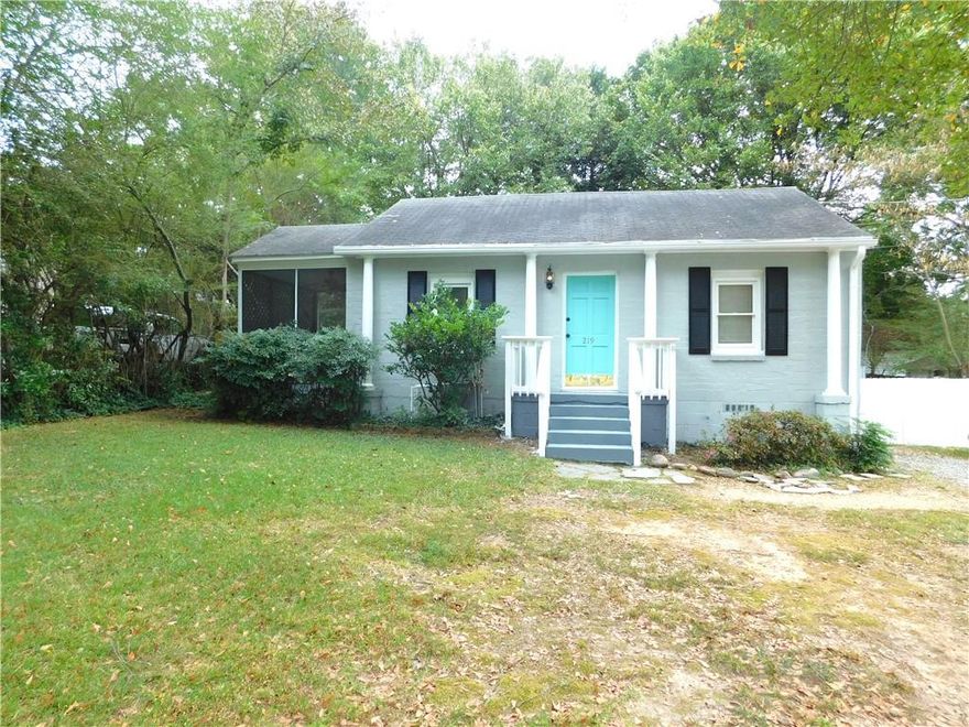 Charming renovated Bungalow. Landscaping included.  No carpet. Living room has a decorative fireplace and built-in shelving. The hall has a laundry alcove with a stackable washer/dryer included. There are two bedrooms with ceiling fans and closets. Full remodeled bath has a single vanity and a tiled tub/shower combination. There is a separate dining room adjacent to the remodeled kitchen with new cabinets, Granite counters, all new stainless appliances (refrigerator, electric stove, dishwasher & microwave). There is access to the large rear fenced in yard with storage shed. There is a screened in rear porch with fan/light. Parking on driveway. Home also has a front yard. Great location within blocks from Marietta Square with easy access to major highways, entertainment, shopping, dining, close to the bus terminal, and near the Battery, Truist Park and not far from Smyrna.   No aggressive dog breeds.
