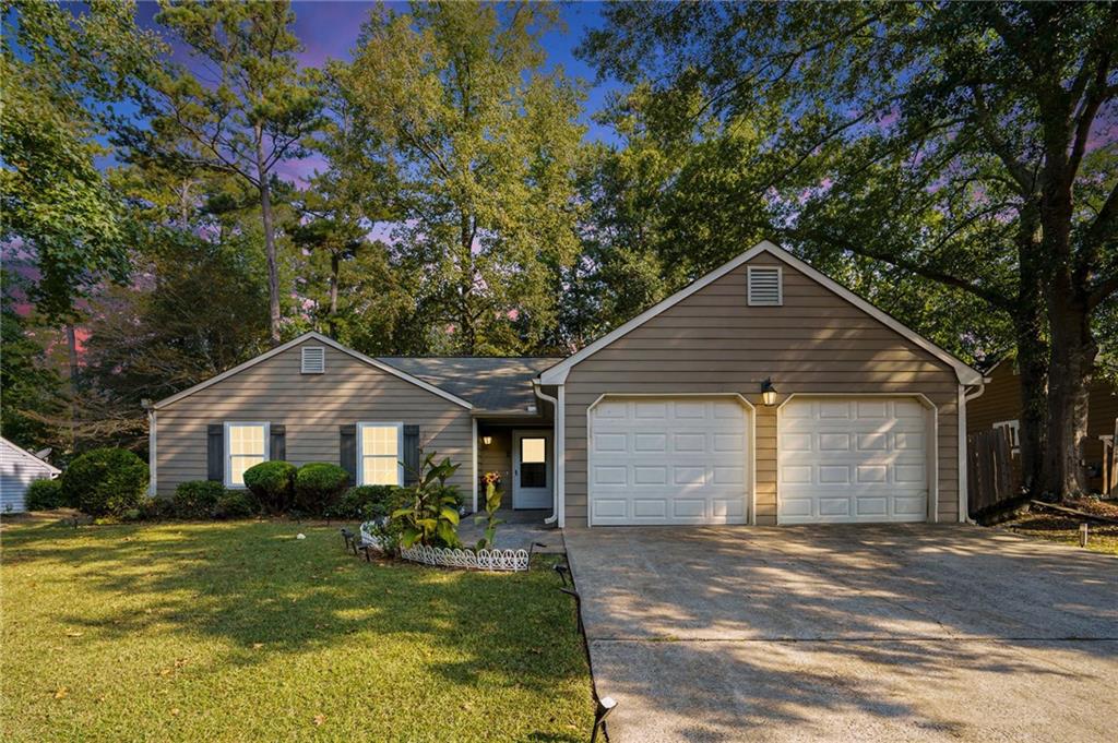 Highly desirable ranch home in the heart of Cobb County and located in the sought-after McEachern High School District! Situated on a level lot with charming white fencing, this property offers ample parking with a long driveway and a two-car garage. Inside, you’ll find vaulted ceilings and a spacious family room ideal for entertaining. The updated kitchen features granite countertops, custom soft-close cabinetry, and an inviting eat-in area with a bay window that fills the space with natural light. Down the hall, three generously sized bedrooms include an oversized primary suite with walk-in closet, dual vanities, and a tub/shower combo. The secondary bath has also been tastefully updated, providing comfort and style for family and guests. Step outside to enjoy an extended patio and a large backyard perfect for kids, pets, and outdoor gatherings. Located in a swim/tennis community just minutes from shopping, dining, and major interstates. Don’t miss this rare single-level gem—schedule your private showing today!
