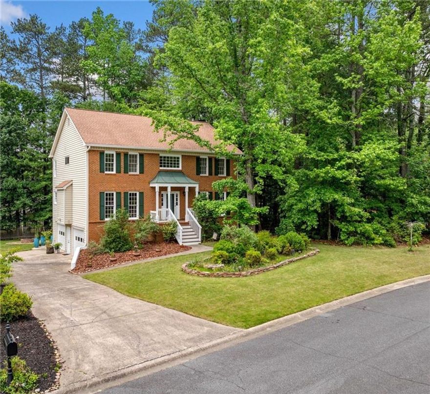 This spacious traditional in Hillgrove High district  is great for entertaining.  The formal living room right off the 2 story foyer makes a great office or library.  Dining area is quite large and views the foyer. You will love the cozy great room with brick gas log fireplace. It has beautiful rich wood wainscotting and views the kitchen.  The updated kitchen has been renovated with expresso cabinets, granite counters, pantry & an eat in area. The main floor has LPV flooring and tile.  Most of home has been freshly painted.  Owners' suite  has trey ceilings and a spa bath with double vanities, jetted tub and separate shower.   Secondary bedrooms are quite spacious and share a full bath with tub/shower combination. The terrace level has a large finished living room  which would make a great office or exercise room. There is also a large storage room which was once a workshop.  The two car garage is oversized and has a workshop area.  Updated HVAC system and water heater. There is a new deck that has an under-deck roof for the patio below. You will love the level private yard with mature trees and plantings and a peach tree in the side yard that produces an abundant amount of fruit.   Wynford Chace is a popular swim tennis community with playground and clubhouse.  Easy access to Windy Hill Connector, Barrett Parkway, the Aves of West Cobb and shopping makes this a great choice to call home.