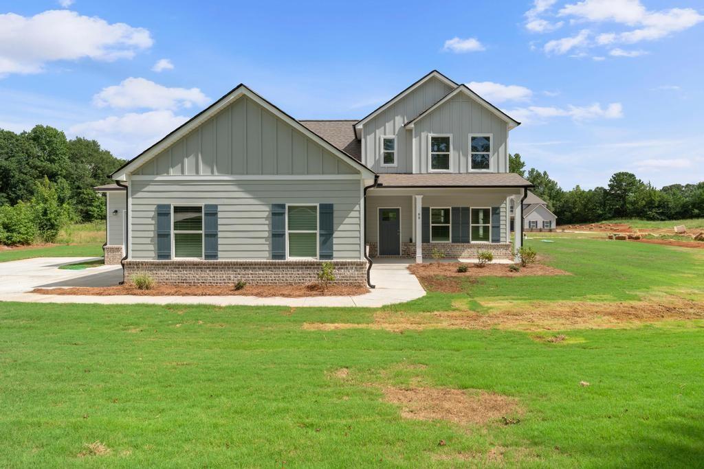 New Construction in Ola School District! This beautiful 4 bedroom, 2.5 bath home sits on 1.263 acres and features the master suite on the main level. You'll love the open kitchen and family room layout-perfect for everyday living and entertaining. Enjoy relaxing on the rocking chair front porch or the covered back patio. A spacious 3-car garage completes the home with extra room for storage or parking. Home comes standard with Color Plus Hardie Siding, Granite Countertops, Wood Tread Stairs, LVP in common areas and bathrooms, carpet in bedrooms and closet. One Year Builder Warranty