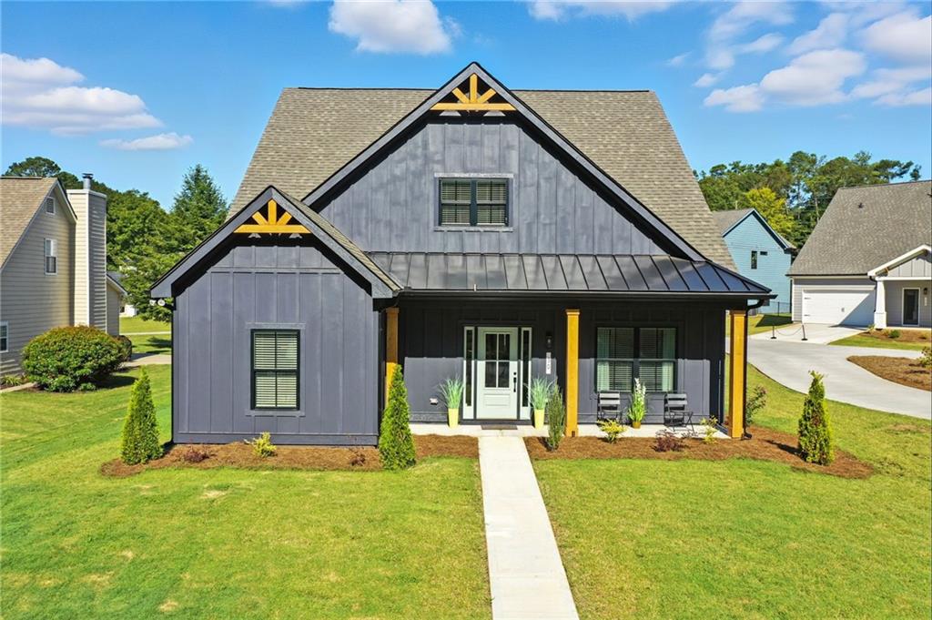 TO BE BUILT LOLA LITE–Now selling at Ferguson Corners, a semi-custom boutique community by MarDon Construction—known for exceptional quality and luxury details. The Modified Lola Plan offers a spacious and open main level with designer finishes throughout. The chef’s kitchen features quartz countertops, stainless steel appliances, upgraded soft-close cabinetry, and a large center island overlooking the dining area and family room—perfect for entertaining.
The main-level primary suite includes a spa-inspired en suite bath and oversized walk-in closet. Also on the main floor: a private office/flex room with French doors, a stylish half bath, a custom mudroom, and a covered back patio. Upstairs you'll find two generous secondary bedrooms, a full bathroom, and a flexible loft area ideal for a media room, playroom, or second office. Located just minutes from Downtown Emerson, Downtown Cartersville, Red Top Mountain, and Lake Allatoona, Ferguson Corners offers a unique blend of style, comfort, and convenience. Ask about current builder incentives! Visit our model home or contact the onsite agent for more information.