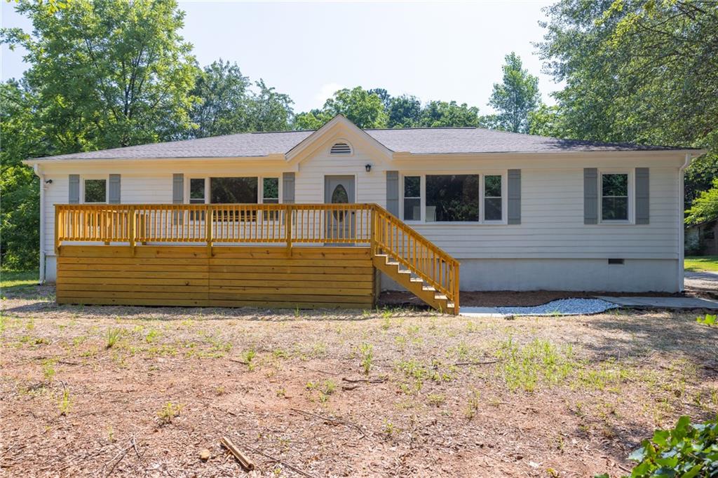 Modern Retreat Just 5 Minutes from Downtown Woodstock—Private, Peaceful, and Close to Everything!
Welcome to your dream rental—a rare find that offers the best of both worlds: quiet seclusion and unbeatable convenience. Nestled on a flat, wooded ¾-acre lot, this beautifully renovated ranch-style home is just 5 minutes from vibrant Downtown Woodstock, 7 minutes to the Church, and moments from shopping, gyms, dining, entertainment, and major highways. Yet it feels worlds away in its peaceful, private setting.
Step inside to discover a home that blends modern upgrades with timeless charm. Original 1950s hardwood floors flow throughout sun-drenched living areas, creating warmth and character. The inviting sitting room boasts a cozy fireplace and a large picture window overlooking a stunning mature tree—perfect for morning coffee or relaxing after work.
This home was thoughtfully redesigned as a 3-bedroom with a spacious owner's suite, originally two bedrooms combined into one luxurious retreat with added privacy. Prefer four bedrooms? The layout allows for an easy conversion back to 4 beds to suit your needs.
The kitchen is all-new and fully equipped, featuring real-wood soft-close white shaker cabinets, stainless steel appliances, and a bar-height counter ideal for casual meals or coffee chats. Both bathrooms offer stylish comfort—one with a garden soaking tub, and the other completely remodeled with modern finishes.
Enjoy indoor-outdoor living with a screened-in patio, perfect for dining al fresco or listening to birdsong. The fully fenced backyard includes two bonus structures—a shed and a gazebo-style outbuilding ready to become your she shed, man cave, artist studio, or home gym.
With fresh paint inside and out, a newer roof, fruit trees, and plenty of parking for guests or work vehicles, this home has everything. Plus, NO HOA!